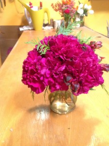 Bright Carnations with a little bit of greenery makes a nice arrangement for a Belly Bar. 