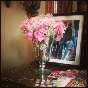 Soft pink 'Titanic' Roses in a jeweled mercury glass vase greeted the guests as they walked in the door. (Vase available for rent) 